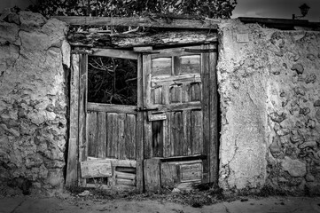 the old and abandoned wooden door