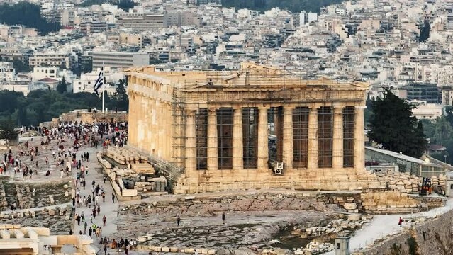 Greece Acropolis city of Athens parthenon symbol of ancient aerial view slide from drone zoom panorama of residential buildings at sunset summer. Lights sun, lens flare. World Heritage sites. History