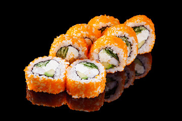 sushi roll with shrimp tobiko cucumber cream cheese avocado on a black mirror background