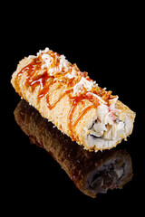 warm sushi roll hot dog in panko on a black mirror background