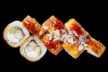 sushi roll with cream cheese grilled shrimp panko avocado on a black mirror background