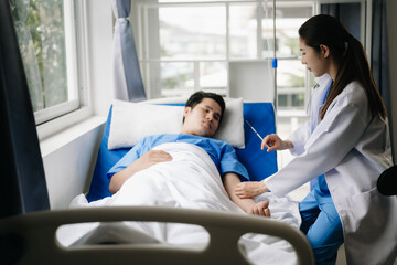 Obraz premium Doctor discussing treatment with male patient talking and laughing sitting on examination bed in clinic or hospital.