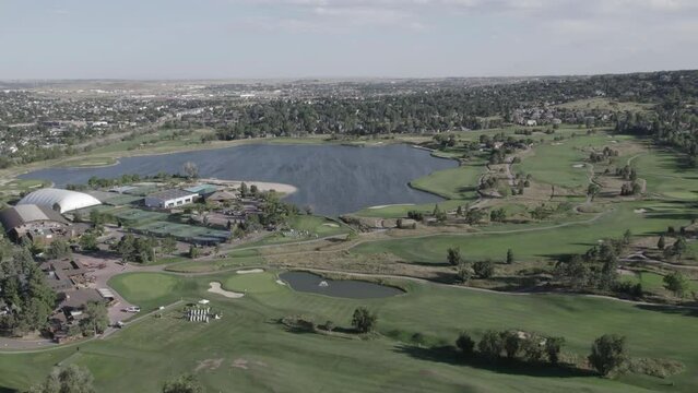 Colorado Country Club Golf Course, with Cheyenne Mountain in the background in Colorado Springs, Colorado. Aerial 4K drone video in the Rocky Mountains. 
