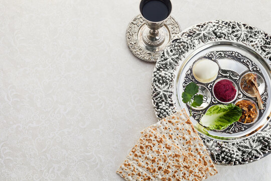 Composition with symbolic Passover, Pesach, items and meal on vintage background,