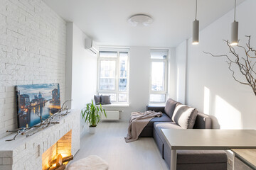 Cozy luxury modern interior design of a studio apartment in extra white colors with fashionable...