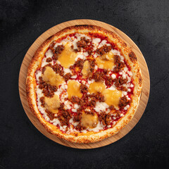Top view on pizza with cheddar cheese and minced beef