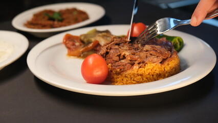 Stuffed lamb with appetizers on the presentation plate