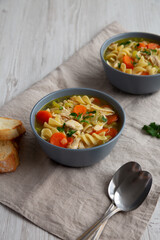 Homemade Chicken Noodle Soup in a Bowl, side view.