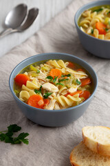 Homemade Chicken Noodle Soup in a Bowl, side view.