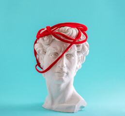 David's head wrapped in red thread on blue background.