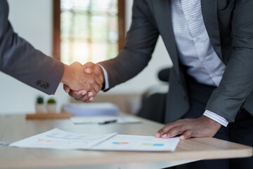 african american and asian people hand shaking successful corporate partnership deal welcoming opportunity in office agreement professional greeting meeting colleagues partners