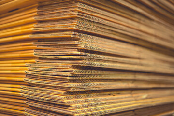 Paper pile and piece of cardboard at the recycle