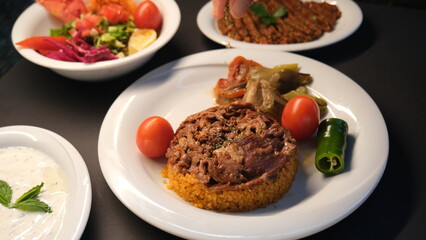 Stuffed lamb with appetizers on the presentation plate