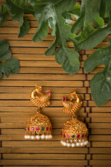 product photos of still life like watch cup nail polish jewel