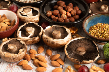 Fototapeta premium nuts and dried fruits. Portobello, avellanas, semillas en bowls. Comida saludable. Vegetariana