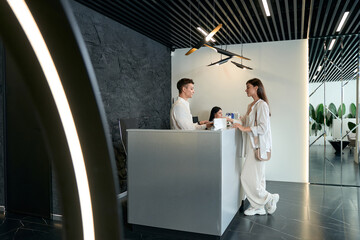 Client paying for services in beauty salon