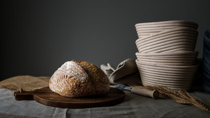 Artisan Batard Sourdough healthy Bread. Open crumb high hydration Sourdough french country bread set on dark background. - 586946374