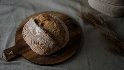 Artisan Batard Sourdough healthy Bread. Open crumb high hydration Sourdough french country bread set on dark background. - 586946376