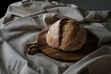 Artisan Batard Sourdough healthy Bread. Open crumb high hydration Sourdough french country bread set on dark background. - 586946383
