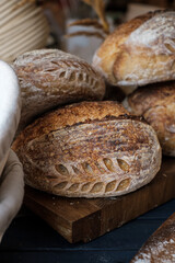 Artisan Batard Sourdough healthy Bread with leaf scoring. Open crumb high hydration Sourdough bread set on white table. - 586946385