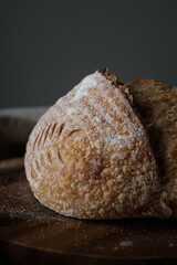 Artisan Batard Sourdough healthy Bread. Open crumb high hydration Sourdough french country bread set on dark background. - 586946387
