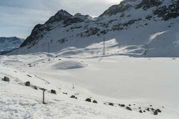 Fototapeta na wymiar Snow covered mountain panorama on the Julier pass in Switzerland