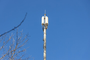 Close up of antenna repeater tower on blue sky