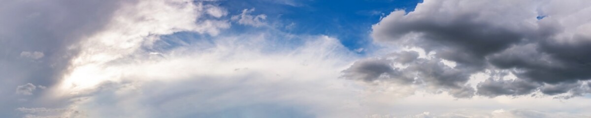 Naklejka na ściany i meble Dramatic panorama sky with storm cloud on a cloudy day. Panoramic image.