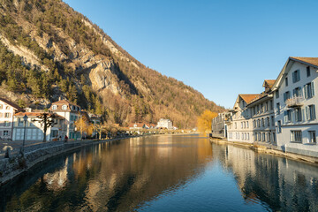 Fototapeta na wymiar Waterfront at the Aare river in Interlaken in Switzerland