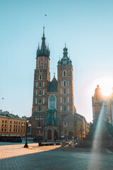 Old city center view with Adam Mickiewicz monument and St. Mary's Basilica in Krakow on the...