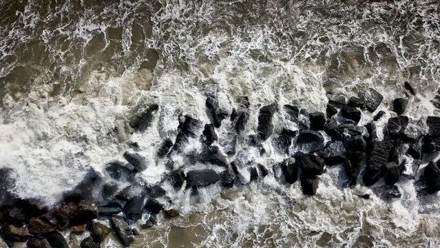 Elmer beach breakwater. Bognor Regis. South of England. Cinematic drone flight