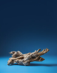 Fototapeta premium driftwood on plain blue background with copy space, made with generative ai