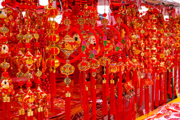 Various festive items sold at the Chinese New Year market.
Translation: Happy New Year, peace in...
