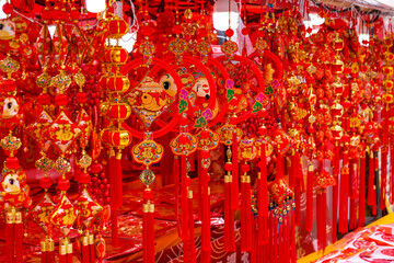 Various festive items sold at the Chinese New Year market.
Translation: Happy New Year, peace in and out, various blessings.