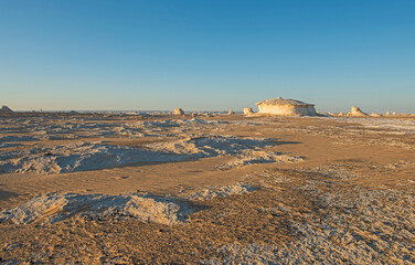 Barren desert landscape in hot climate with rock formation