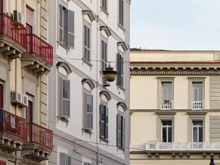 Obraz premium Exterior buildings architecture on the Via Caracciolo ( Lungomare di Napoli a Mergellina) promenade at the Mediterranean sea shore in Naples, Italy