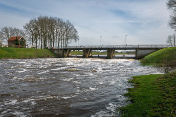 Obraz premium The weir at the village of Junne, much visited by tourists because of the beautiful rain river called 
