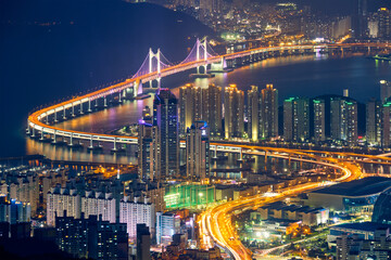 Fototapeta na wymiar Busan cityscape with skyscrapers and Gwangan Bridge illuminated at night. Busan. South Korea