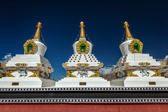 White chortens (Buddhist stupas) in Thiksey gompa. Ladakh, Jammu and Kashmir, India
