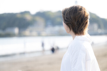 Fototapeta premium Woman looking out to sea, menopausal and other images, no face