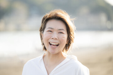 Smiling, laughing, joyful Japanese women in their menopause and 40s.