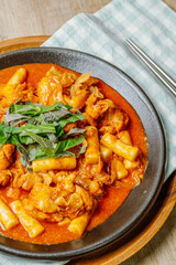Dakgalbi, korean style Spicy Stir-fried Chicken with rice cake, Chicken pieces marinated in a gochujang, and stir-fried in a flat grill pan with cabbage, sweet potato, carrots, and tteok (rice cakes).