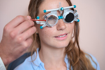 Elegant lady is receiving eye care consultation in the medical office