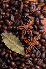 Spices in the Kitchen. Coffee Grain background. Star anis and bayleaf over Spices