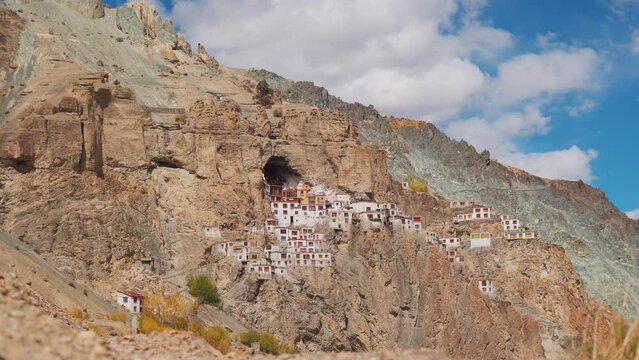 4K shot of Phugtal Monastery made in a natural cave near Purne village in Zanskar, Ladakh India. Ancient monastery made in a cave more than 2550 years ago in India. Monastery built inside the cave.	