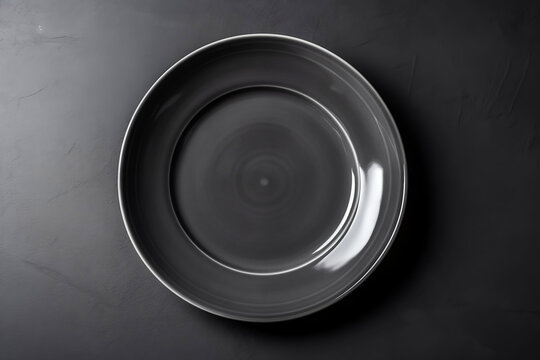  Empty gray plate( ceramic) set on a dark gray background. Free space for text. Top view. Generative ai.