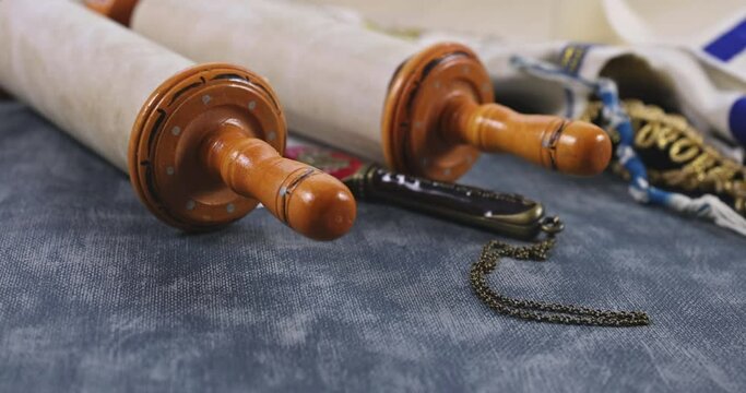 An religious attributes for prayer with Jewish symbol of Torah holy book, shofar horn shawl, tallit