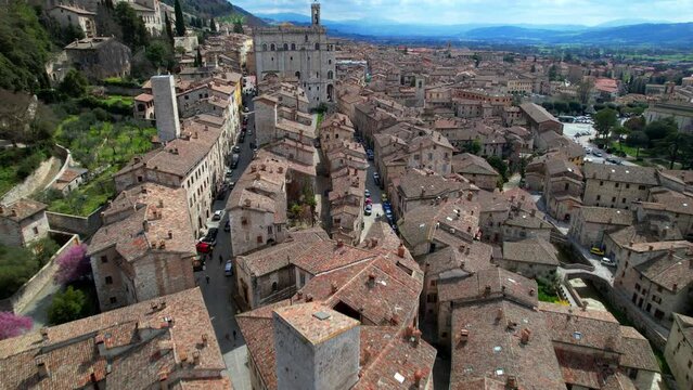 Aerial drone overflight of medieval town Gubbio in Umbria. Italy travel .great historical italian landmarks and best tourist destinations
