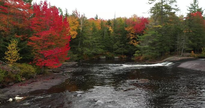 Aerial view of Bog River Falls near Tupper Lake in Adirondack Park in Upstate New York during fall.