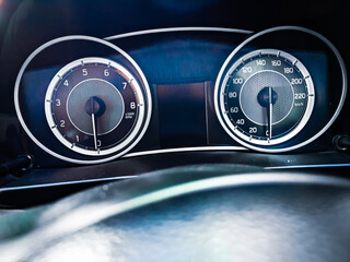 a closeup picture of speedometer of car
